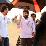 Trivikram pointing his fingers at Mahesh Babu