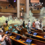 Two protesters carrying colour smoke flare detained outside Parliament