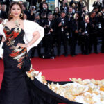 Dressed in black & gold gown, Aishwarya walks the red carpet at Cannes with injured arm in cast