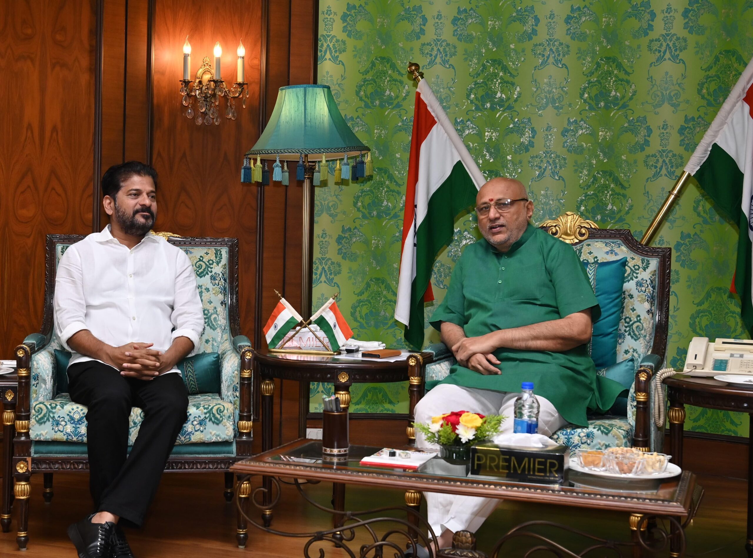 Telangana CM meets outgoing Governor Radhakrishnan