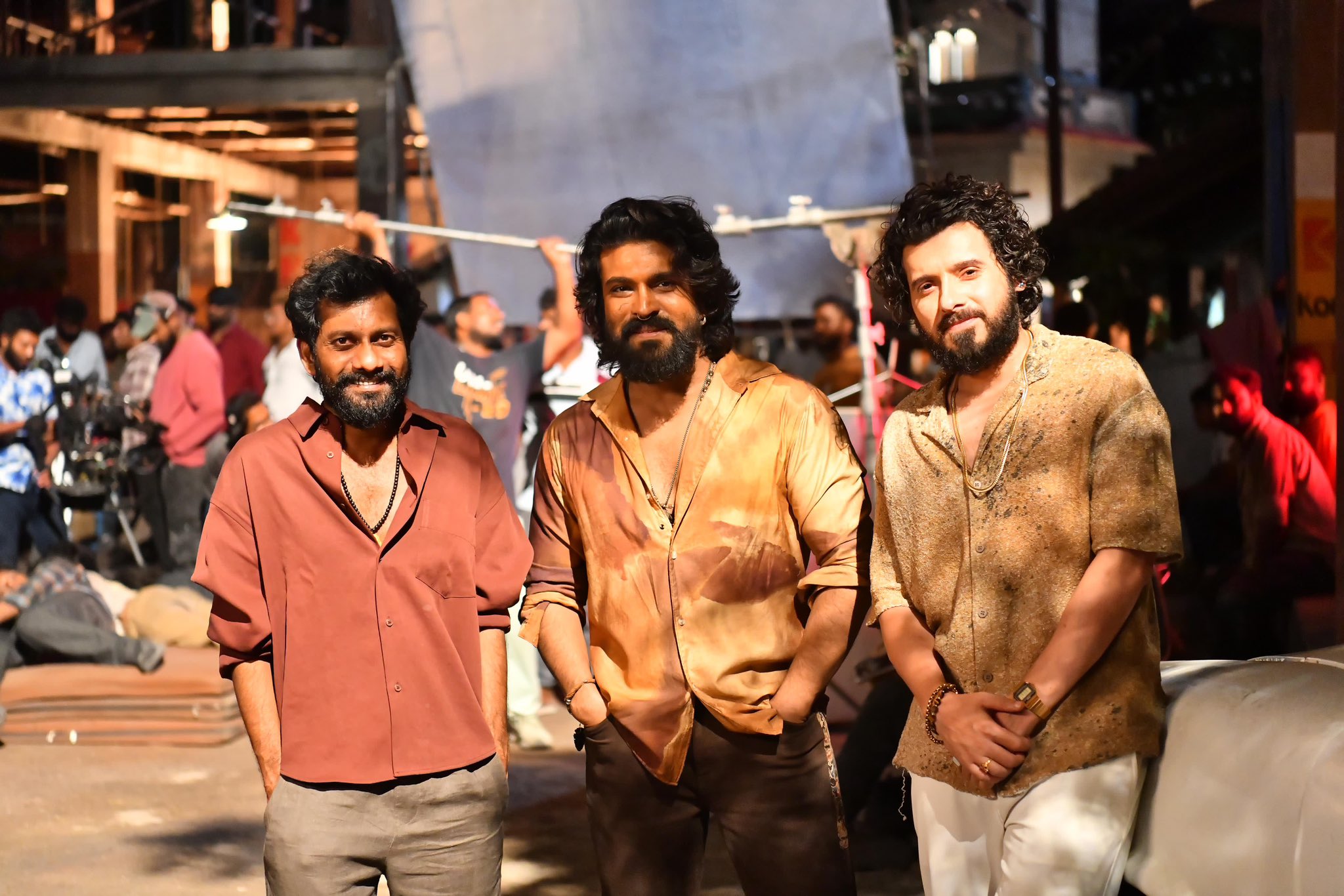 Buchi Babu Sana Shares Viral Set Photos of Ram Charan and Divyenndu Sharma from “Peddi”